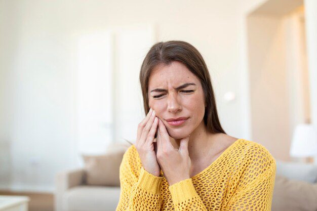 A woman with tooth ache in need of tooth scaling and root planing 
