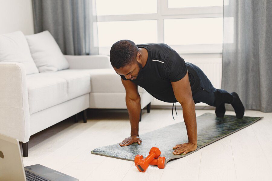 A man planning to do a 10 minute workout session in his home 