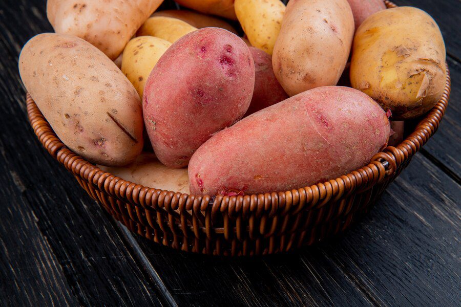 A bowl of fresh Sweet potatoes, which is amongst healthy foods.