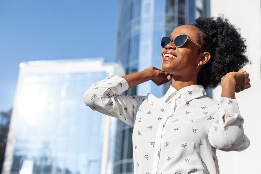 A lady feeling positive, as a way to metaphorically show the benefits of isolating oneself.