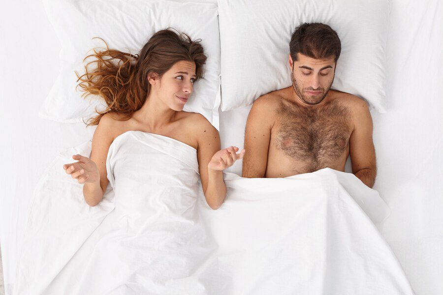 Does the size of your penis matter? A man and woman in bed. The woman and man have a certain facial expression to show if size really matters .