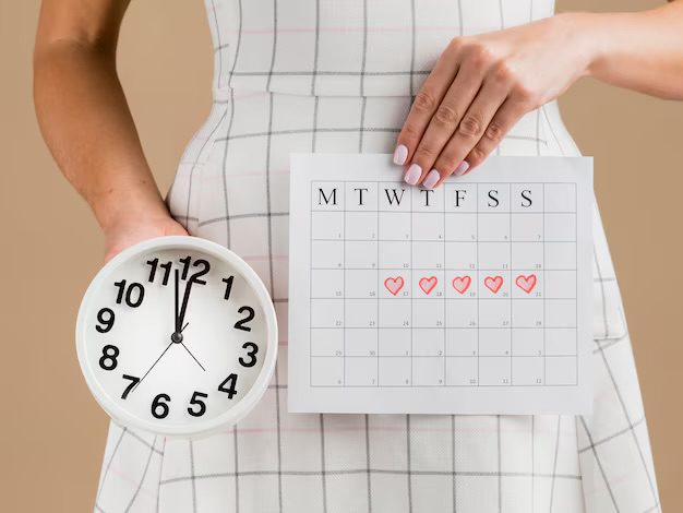 A lady with a journal to predict when she starts ovulating.